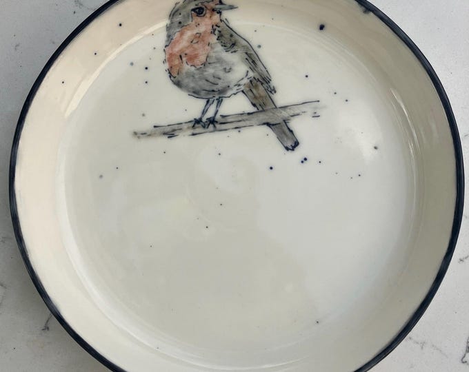 Handmade cream coloured shallow ceramic bowl with hand painted robin design for trinkets, snacks, or decorative item. Free U.K. delivery