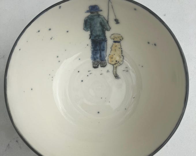 Handmade  small cream coloured ceramic bowl with hand painted fisherman and dog  design for trinkets, dips, snacks, or decorative item.