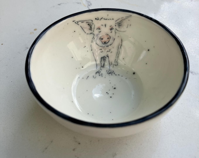 Handmade  small cream coloured ceramic bowl with hand painted pig design for trinkets, dips, snacks, or decorative item.