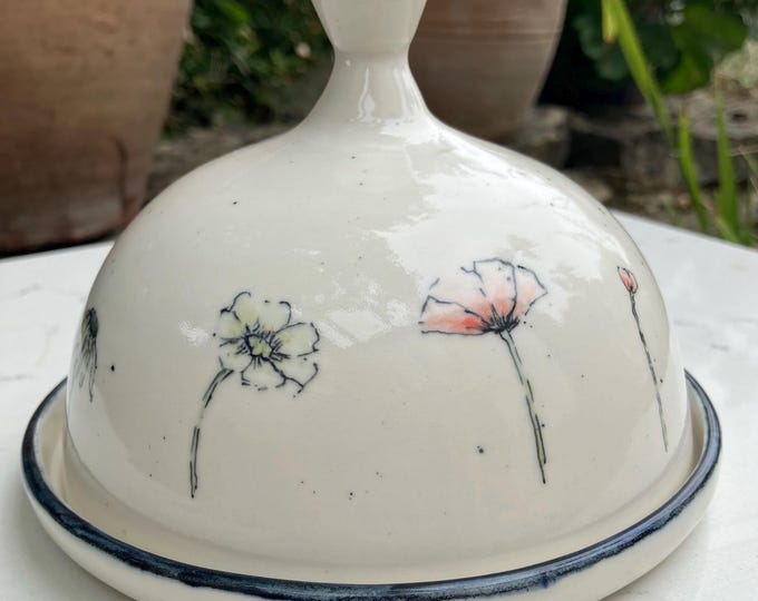 Beautiful handmade ceramic cream coloured dome butter dish with hand painted wildflowers design. Practical decorative item.