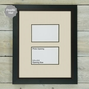 May include: A black picture frame with a double mat and two openings. The top opening is 5.5 inches by 5.5 inches. The bottom opening is 3.5 inches by 5.5 inches. The frame is on a wood background.