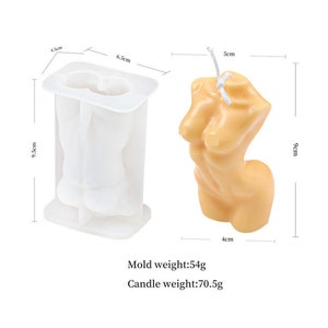 May include: White silicone mold for making a candle in the shape of a human torso. The mold is 9.5 inches tall, 6.5 inches wide, and 4.5 inches deep. A finished candle is shown next to the mold. The candle is 9 cm tall, 5 cm wide, and 4 cm deep. Mold weight: 54g. Candle weight: 70.5g.