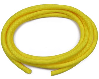 May include: A bright yellow braided cord, coiled in a circle, with a textured surface.