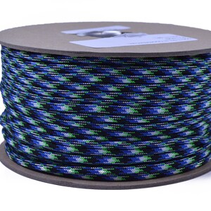May include: A spool of blue, green and white camouflage paracord.