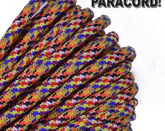 May include: Close-up of a spool of multi-colored paracord with a black, white, red, yellow, and blue pattern. The text "BORED? PARACORD!" is visible in the upper right corner of the image.