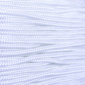 May include: Close-up of a bundle of white nylon cord. The cords are tightly woven together, creating a textured surface. The color is a bright, clean white, and the cords appear to be of uniform thickness. The image is well-lit, highlighting the texture.