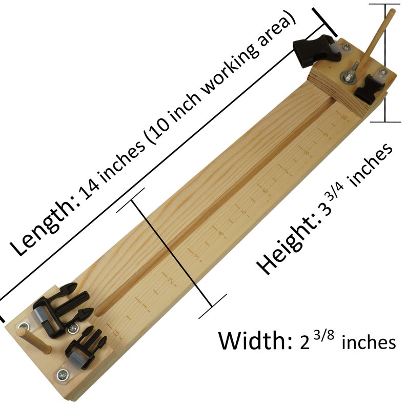 May include: A wooden tool for making leather straps, measuring 14 inches long, 3 3/4 inches high, and 2 3/8 inches wide. It has a 10 inch working area with markings for measuring.