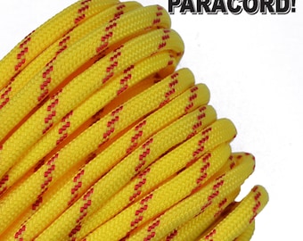 May include: Close-up of a coiled yellow paracord rope with red accent stripes. The text "BORED? PARACORD!" is in the upper right corner. The rope is tightly wound, showing its textured surface.