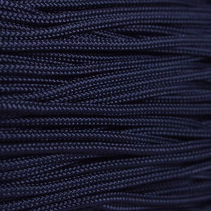 May include: Close-up of a spool of dark blue paracord, a type of strong nylon rope often used for crafting and survival.