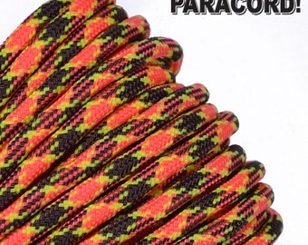 May include: Close-up of a spool of black, neon pink, and neon yellow paracord with a plaid pattern. The text "BORED? PARACORD!" is visible in the background.