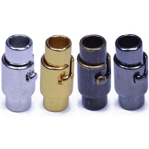 May include: Four magnetic clasps in different finishes: silver, gold, antique brass, and black. Each clasp has a small, decorative latch.