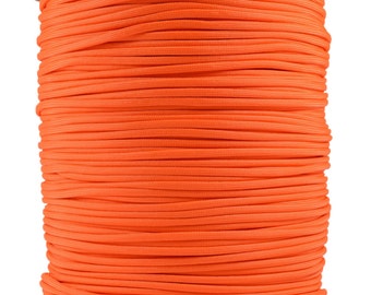 May include: A spool of bright orange paracord, a type of strong nylon rope, is wound tightly on a cardboard tube.