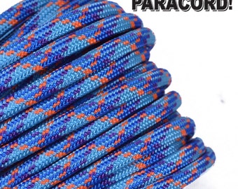 May include: Close-up of blue, orange, and purple paracord with a plaid pattern. The paracord is coiled and ready to be used for crafting.