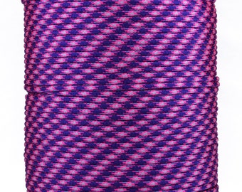 May include: A spool of purple and pink paracord with a diamond pattern.