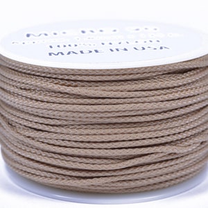 May include: A spool of tan colored waxed cord, 100% nylon, made in the USA.