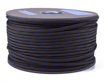 May include: A spool of brown and blue paracord, a type of strong nylon rope often used for crafting and outdoor activities.