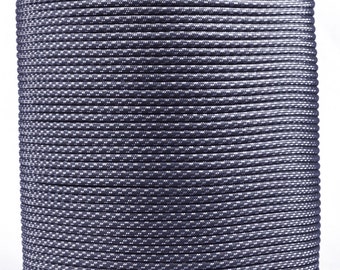 May include: A spool of black and silver paracord, a type of strong nylon rope often used for crafting and survival.