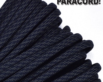 May include: Close-up of a dark blue paracord rope, showing the texture and weave of the cord.  BORED? PARACORD! is written in white text on a white background.