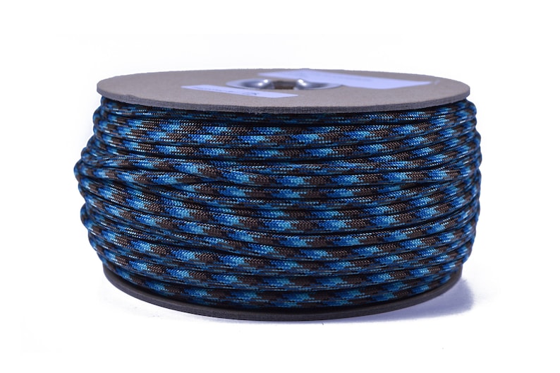 May include: A spool of blue and brown camouflage paracord.