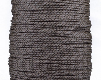 May include: A spool of brown and black camouflage paracord.