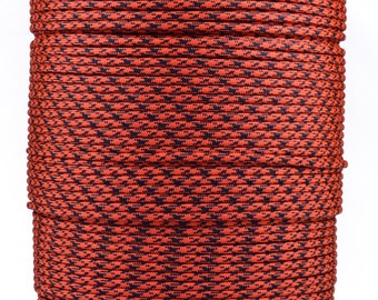 May include: A spool of red and black paracord with a diamond pattern. The paracord is wound tightly around the spool.