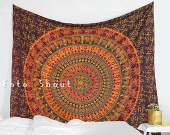 May include: A tapestry with a large, colorful mandala design in shades of orange, yellow, green, and red. The mandala is surrounded by a dark brown background with a small floral pattern.