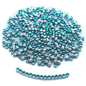 Vintage Swarovski Rose Montees, Blue Zircon, Silver Plated, in size 10ss rosemontee with criss-cross hole, sew-on beads