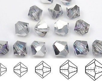 May include: A close-up of 15 clear glass beads with a faceted design. The beads are arranged in a grid pattern on a white surface. The beads are approximately 6mm in diameter.