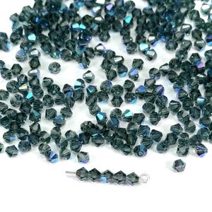 Montana AB Czech Glass Beads Machine Cut Bicones MC Rondell Diamond Shape silvery blue crystals coated with Aurora Borealis 4mm