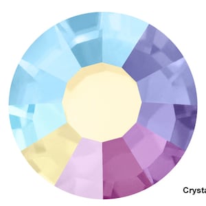 May include: A round, faceted crystal with a rainbow iridescent finish. The crystal has a light blue, yellow, purple, and pink color scheme. The text "Crystal AB" is printed below the crystal.