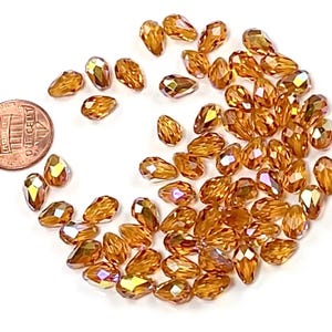 Swarovski Art.# 5500 - 9x6mm Topaz AB Coated Genuine Swarovski Faceted Teardrop Beads 12 pieces SW152