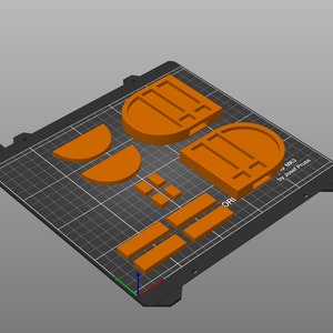 以下が含まれることがあります： オレンジ色のフィラメントで3DプリントされたPrusa i3 MK2プリンターのモデル。モデルは、フレーム、エクストルーダー、ベッドなど、いくつかの部品で構成されています。モデルは、グリッドパターンが施された黒いビルドプレートに印刷されています。