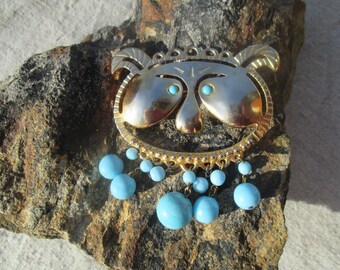 Big mythical animal brooch, gold metal and turquoise glass