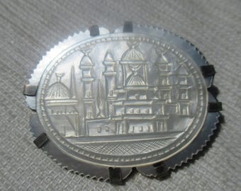 Incredible carved mother of pearl brooch in solid silver