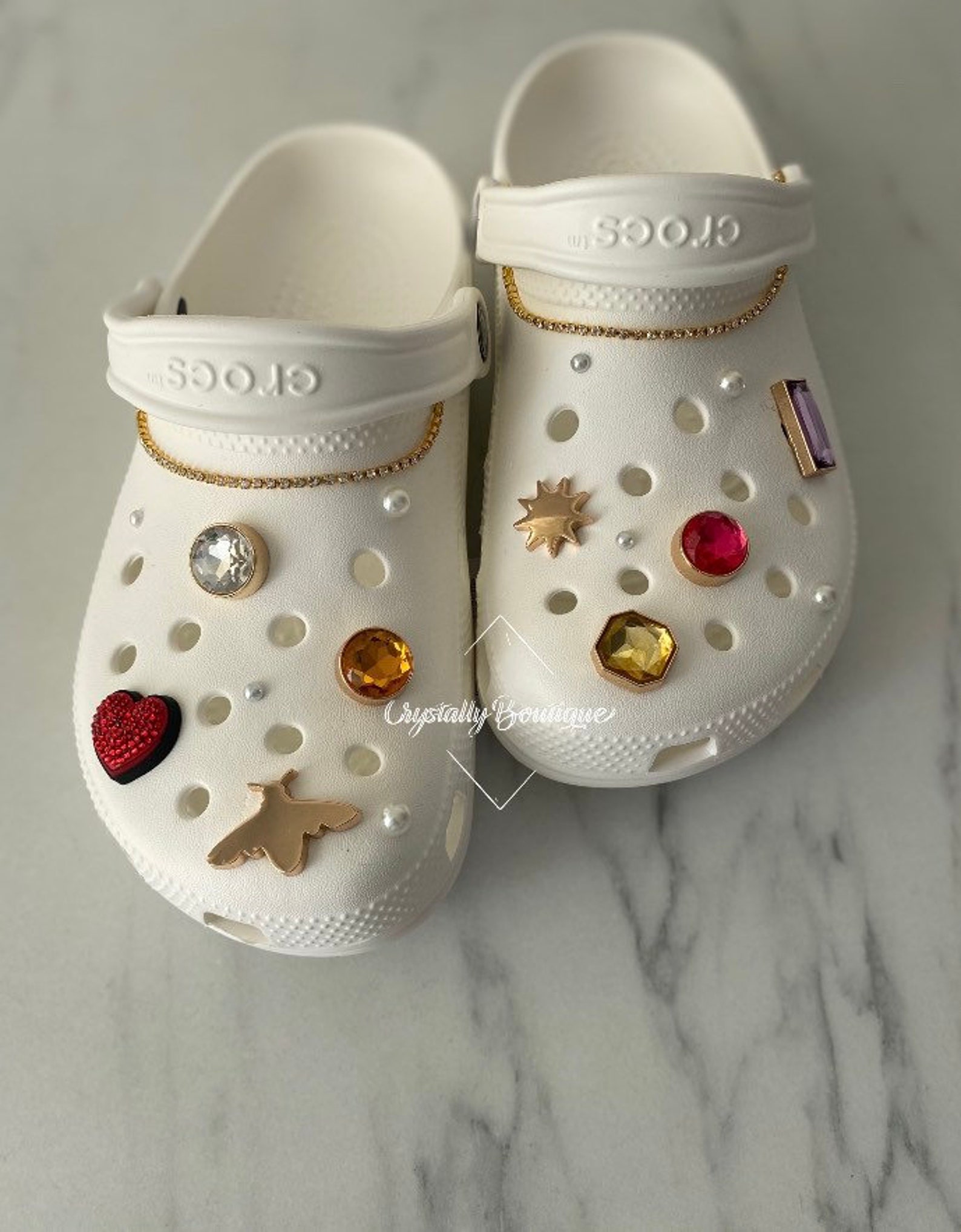 crocs white clogs with chain