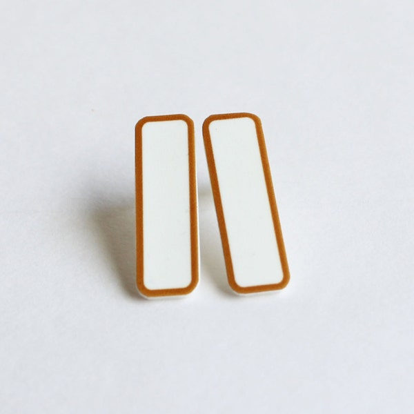 Long rectangular gold and white earrings