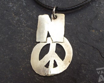 Anti War military dog tag style necklace, hand cut from a spent bullet case, recycled brass.