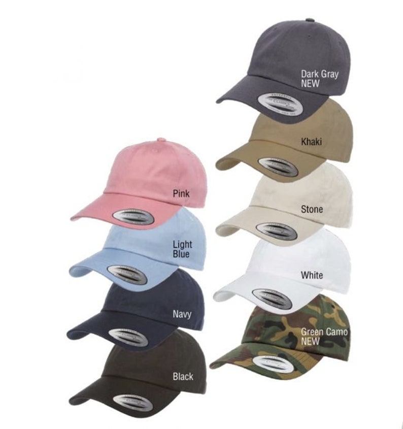 May include: A collection of 10 baseball caps in various colors, including pink, light blue, navy, black, khaki, stone, white, green camo, and dark gray. The caps are all the same style, with a curved brim and a small logo on the front.