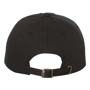 May include: A black baseball cap with a brown adjustable buckle closure.