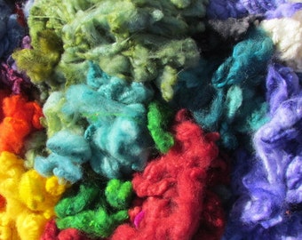 100 gms Washed, dyed, uncarded wool pieces. Assorted Colours.