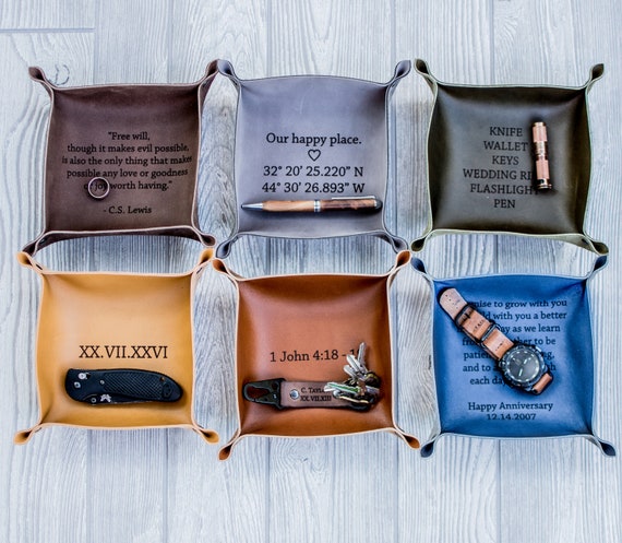 1,760 favorites don't lie — this riveted, multi-color personalized leather catchall is the proven crowd-pleaser of the category.