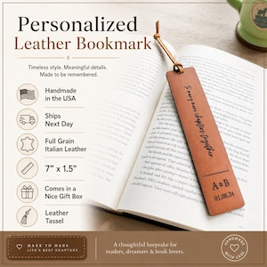 May include: A rectangular brown leather bookmark with a leather tassel, featuring the engraved text 'To many more chapters together' and 'A & B' with the date '01.08.24'. The bookmark measures 7 inches by 1.5 inches and rests on an open book.