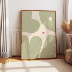 May include: A framed abstract art print with a green and cream color scheme. The print features a stylized design of the word "love" with a small red heart in the center.