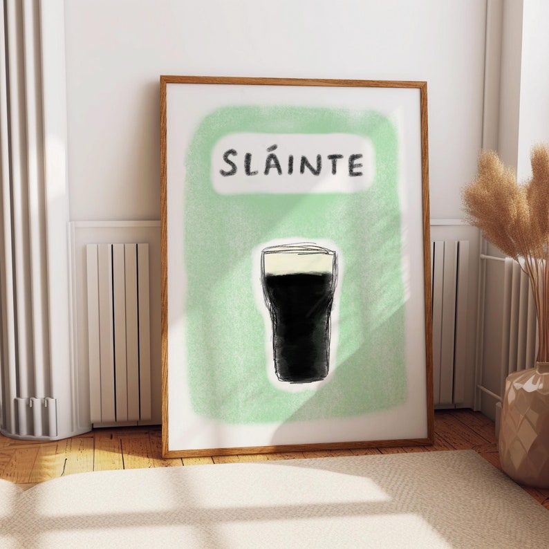 Slainte Guinness print hand drawn illustration of a guinness pint glass with text that says Sláinte hand drawn in charcoal and pastel oil