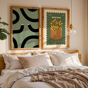 Illustration poster depicting two Guinness Glasses forming the famous "Split the G" shape against a sage green backdrop with the word "Slainte!" This Guinness Print Slainte wall art is perfect home décor for a Home Bar, kitchen, or dining room. It makes a wonderful Christmas gift, a cute Christmas gift for a friend, and a perfect Valentine gift for him or her. The iconic Irish design is ideal for Guinness enthusiasts, Irish men, or anyone seeking a playful accent in their living space.