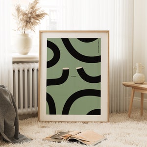 Large wall art print framed showing a green guinness poster with two black guinness pints in the form of wiggly blacklines