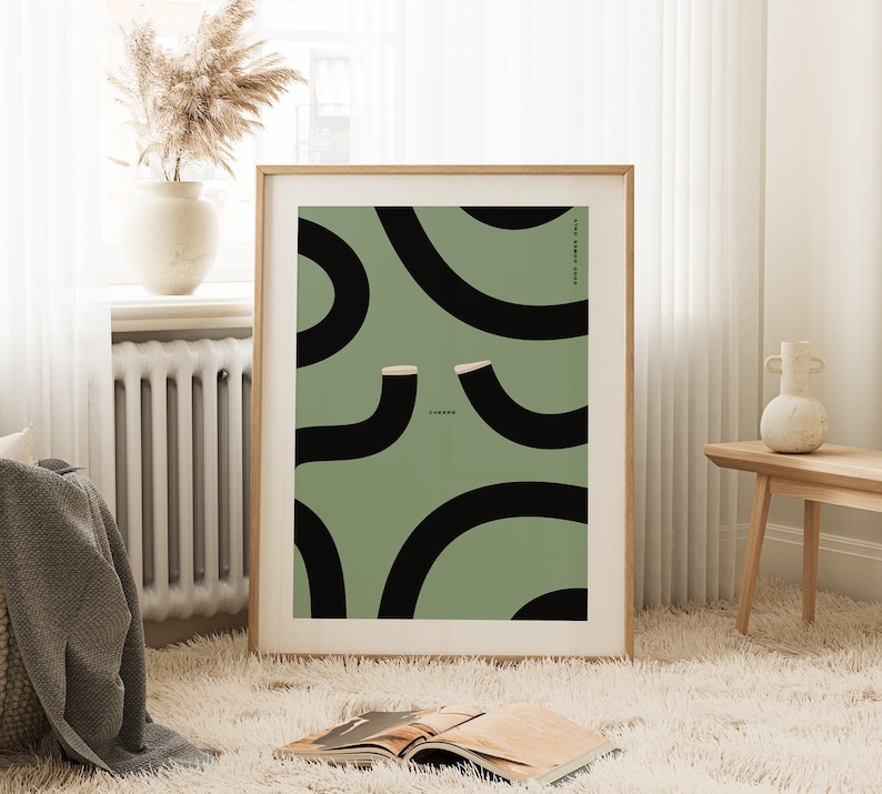 Large wall art print framed showing a green guinness poster with two black guinness pints in the form of wiggly blacklines