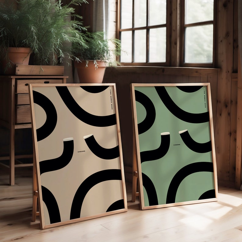 Two Guinness prints in a bright wooden room. One is a beige print and the other is green. Rustic vintage feel