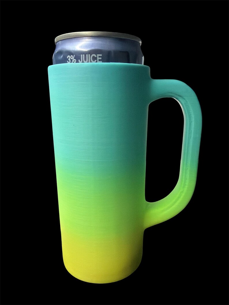 May include: A tall, gradient-colored can cooler with a handle, holding a can labeled "3% JUICE." The cooler transitions from yellow to green to teal. The handle is a curved, open design.