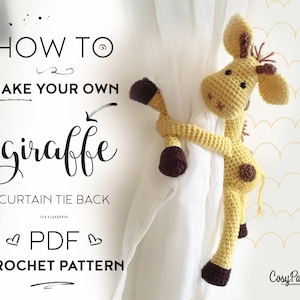 May include: Crochet pattern for a yellow giraffe curtain tie back. The pattern is available as a PDF download. The image shows a crocheted giraffe holding onto a white curtain.